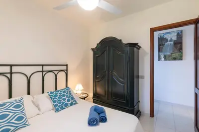 Letto o letti in una camera di Casa Marilò - wifi e vista mare