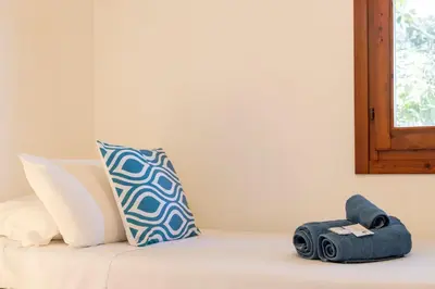 Letto o letti in una camera di Casa Marilò - wifi e vista mare