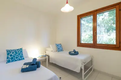 Letto o letti in una camera di Casa Marilò - wifi e vista mare
