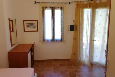 Letto o letti in una camera di Bari Sardo Le More Suite 4