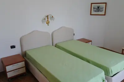 Letto o letti in una camera di Bari Sardo Le More Suite 4