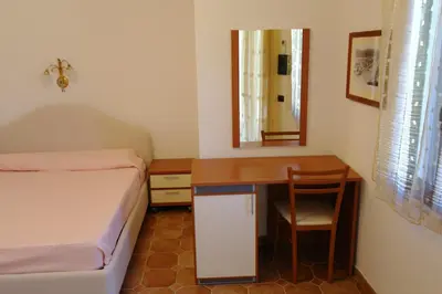 Letto o letti in una camera di Bari Sardo Le More Suite 4