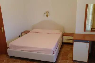 Letto o letti in una camera di Bari Sardo Le More Suite 4