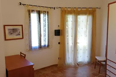 Letto o letti in una camera di Bari Sardo Le More Suite 4
