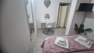 Letto o letti in una camera di Casa Nicole