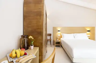 Letto o letti in una camera di Ros'e Mari Green Home Hotel