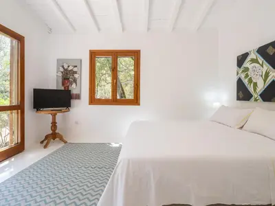 Letto o letti in una camera di Villa Paola