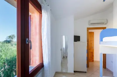 TV o dispositivi per l'intrattenimento presso Villa Mama private compound swimming pool