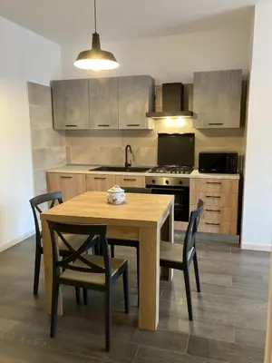 Cucina o angolo cottura di WellHouse Sant'Antioco - Relax e comfort a pochi minuti dalle spiagge