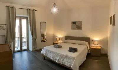 Letto o letti in una camera di WellHouse Sant'Antioco - Relax e comfort a pochi minuti dalle spiagge