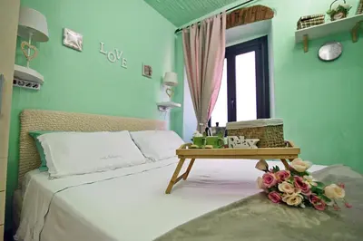 Letto o letti in una camera di Il Portoncino casa vacanze