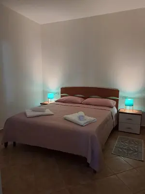 Letto o letti in una camera di Isola's Apartments