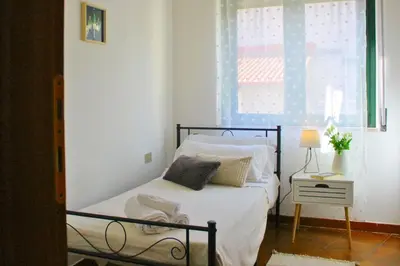 Letto o letti in una camera di Dimidium Apartment