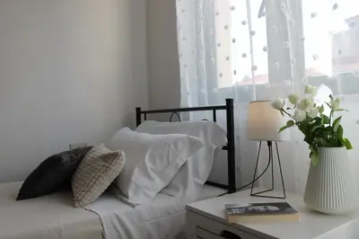 Letto o letti in una camera di Dimidium Apartment