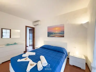 Letto o letti in una camera di Villa Ibiscus, Notteri