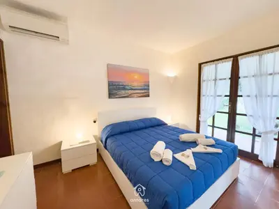 Letto o letti in una camera di Villa Ibiscus, Notteri