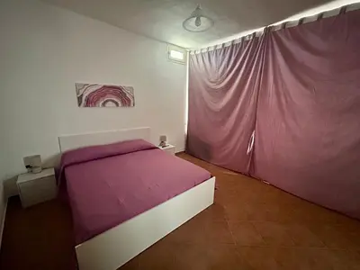 Letto o letti in una camera di Apartment Piras&Tascedda Grazioso Appartamento Vicino al Centro