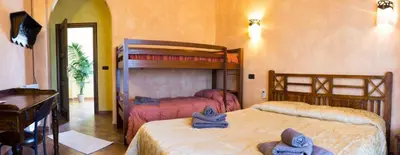 Letto o letti in una camera di Casa Mimosa - Gonnesa