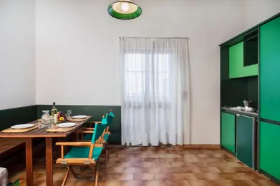 Cucina o angolo cottura di Ecovillage with swimming-pool surrounded by greenery, apartments with air conditioning and outdoor private area