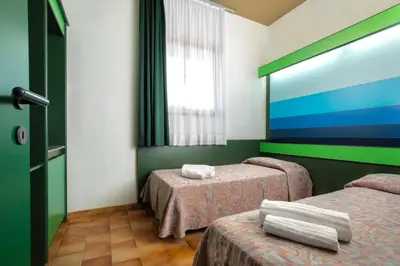 Letto o letti in una camera di Ecovillage with swimming-pool surrounded by greenery, apartments with air conditioning and outdoor private area