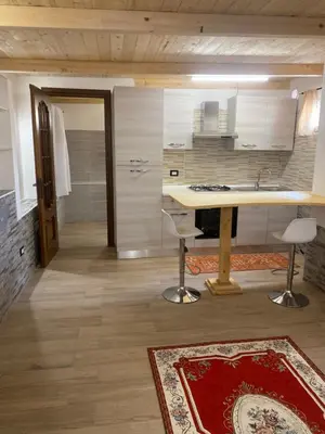 Cucina o angolo cottura di Monolocale indipendente nel quartiere residenziale Genneruxi