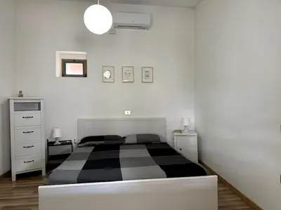 Letto o letti in una camera di Casa Cadoni
