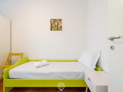 Letto o letti in una camera di Iris Apartment