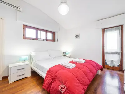Letto o letti in una camera di Iris Apartment
