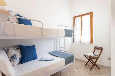Letto o letti in una camera di Funtana Meiga Casa vista mare - Free wifi