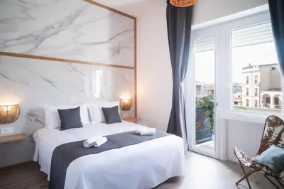 Letto o letti in una camera di New Elegance Suites Guesthouse