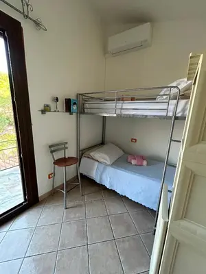 Letto o letti in una camera di Casa Vacanze Eloise