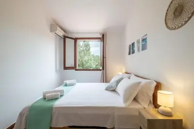 Letto o letti in una camera di Sant'Andrea Villa- 300m From the Beach- Easy Parking- Netflix-Self Check-in