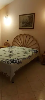 Letto o letti in una camera di Casa Elisa