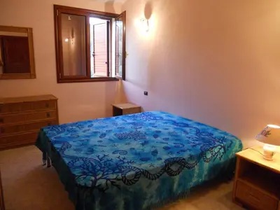 Letto o letti in una camera di Casa Elisa