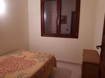 Letto o letti in una camera di Casa Elisa