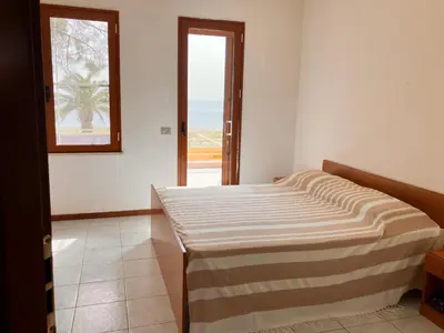 Letto o letti in una camera di Casa vista mare