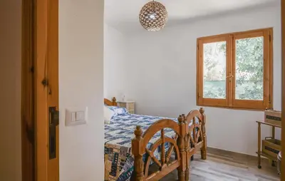 Letto o letti in una camera di Amazing Home In Solanas, Sinnai With Wifi