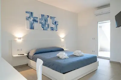Letto o letti in una camera di Su Mari Rooms