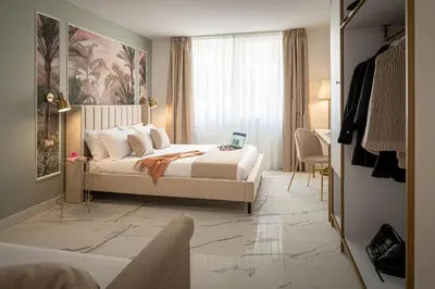 Letto o letti in una camera di Secréte Suites