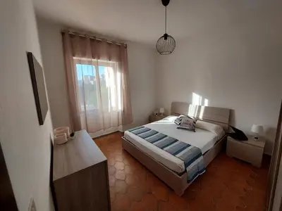Letto o letti in una camera di Sa Domu Sarda