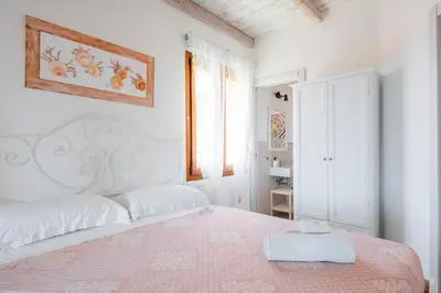 Letto o letti in una camera di Rey Summertime 400 m dal mare piscina esclusiva