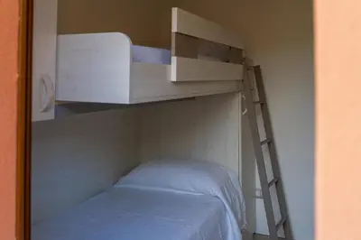 Letto o letti in una camera di Rey Summertime 400 m dal mare piscina esclusiva