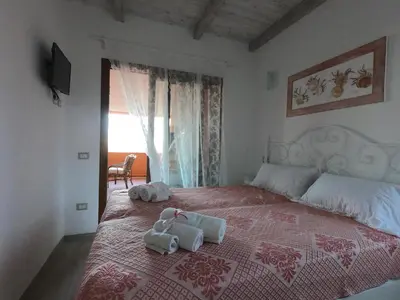 Letto o letti in una camera di Rey Summertime 400 m dal mare piscina esclusiva
