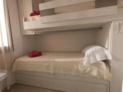Letto o letti in una camera di Rey Summertime 400 m dal mare piscina esclusiva