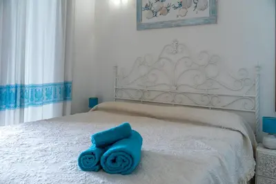 Letto o letti in una camera di Rey Palma House 400 m dal mare piscina esclusiva