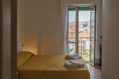 Letto o letti in una camera di La Fenice Suites Sardinia