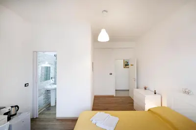 Letto o letti in una camera di La Fenice Suites Sardinia