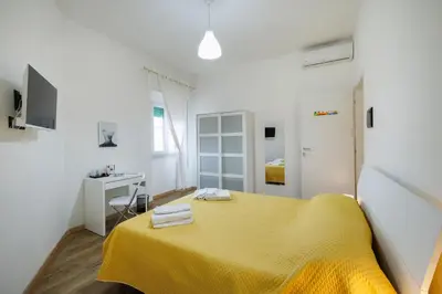 Letto o letti in una camera di La Fenice Suites Sardinia