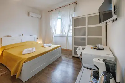 Letto o letti in una camera di La Fenice Suites Sardinia
