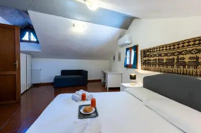 Letto o letti in una camera di La Bouganville WI-FI Cagliari centro storico